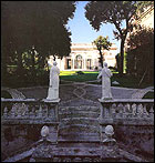 The staircase with the busts and the statues seen from the level of the garden